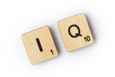 LONDON, UK - JUNE 28TH 2018: The abbreviation IQ - Intelligence Quotient, spelt with wooden letter Scrabble tiles, on 28th June 2018. clipart