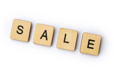 Satılık, word spelt ahşap mektup taşlarla.