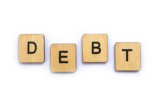 Word Debt Spelt Wooden Letter Tiles — Stock Photo, Image