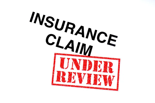 Insurance Claim Heading Stamped Red Review Rubber Stamp — Stock Photo, Image