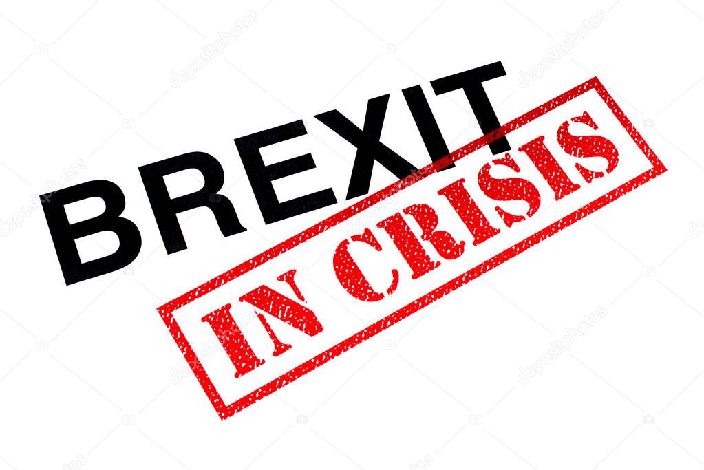 Brexit heading stamped with a red IN CRISIS rubber stamp. 