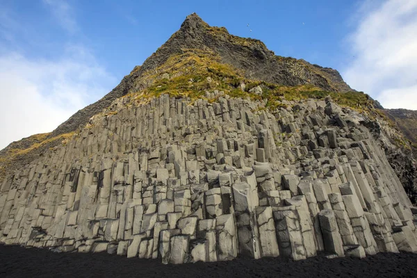 The stunning basalt rock stacks or columns on Reynisfjara Beach on the south coast of Iceland.