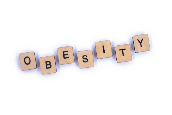 Das Wort Fettleibigkeit Geschrieben Mit Holzbuchstabenkacheln — Stockfoto