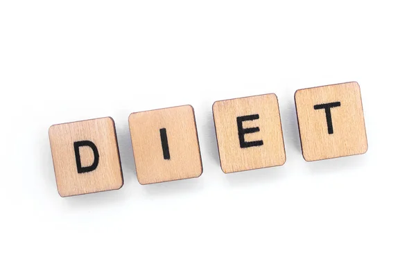 Das Wort Diät Geschrieben Mit Hölzernen Buchstabenkacheln Vor Weißem Hintergrund — Stockfoto