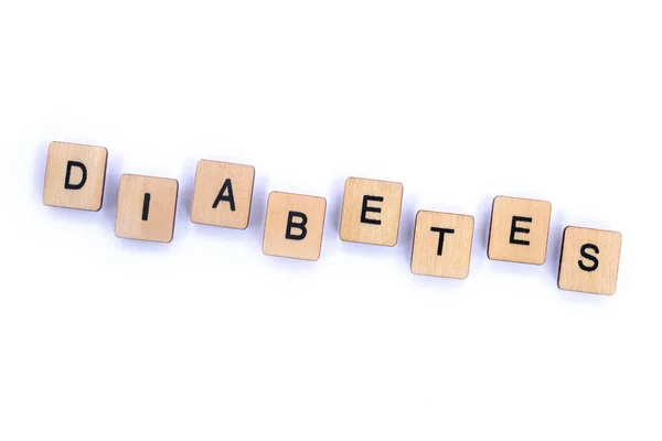 Het Woord Diabetes Spelt Met Houten Brief Tegels Een Effen — Stockfoto