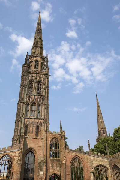 Looking up at the tower of the old Coventry Cathedral, also known as St. Michaels, which was destroyed during a bombing raid by the Luftwaffe in the Second World War and is now a ruin open to the public.