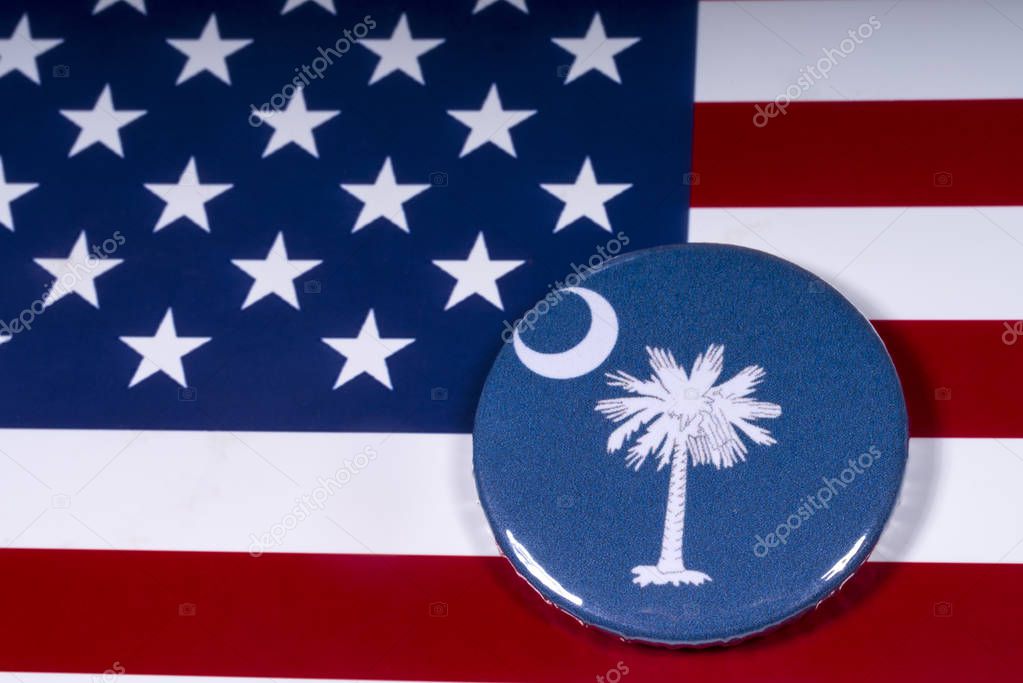 London, UK - November 15th 2018: The symbol of the State of South Carolina, pictured over the flag of the United States of America.
