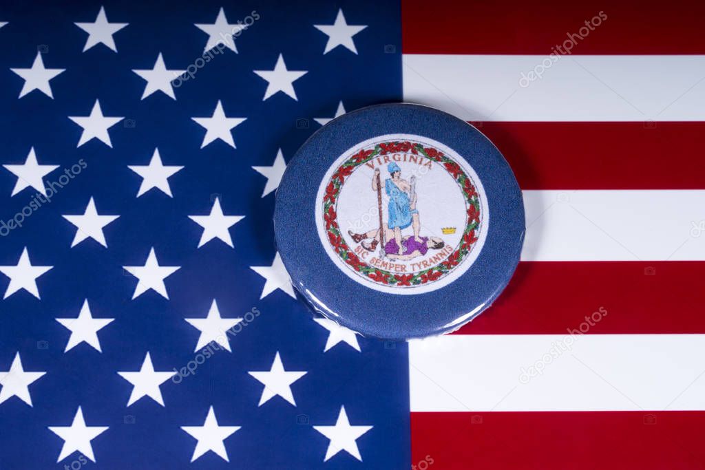 London, UK - November 20th 2018: The symbol of the State of Virginia, pictured over the flag of the United States of America.