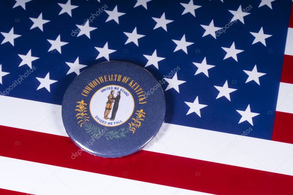 London, UK - November 20th 2018: The symbol of the State of Kentucky, pictured over the flag of the United States of America.