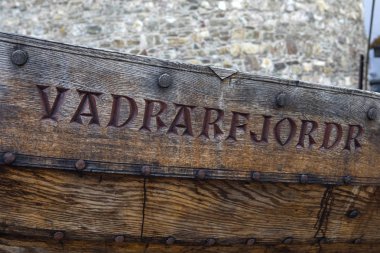 Waterford, Republic of Ireland - August 14th 2018: A close-up of the name of the replica Viking Longboat - Vadrarfjordr, located along the Quay in the historic city of Waterford, Republic of Ireland.  The city has strong Viking connections.   clipart