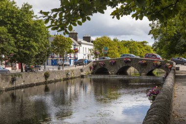 County Mayo, Republic of Ireland - August 21st 2018: A bridge over the Carrowbeg River in the beautiful Irish town of Westport. clipart