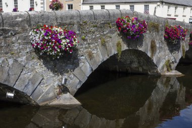 A bridge over the Carrowbeg River in the town of Westport, County Mayo, Ireland. clipart