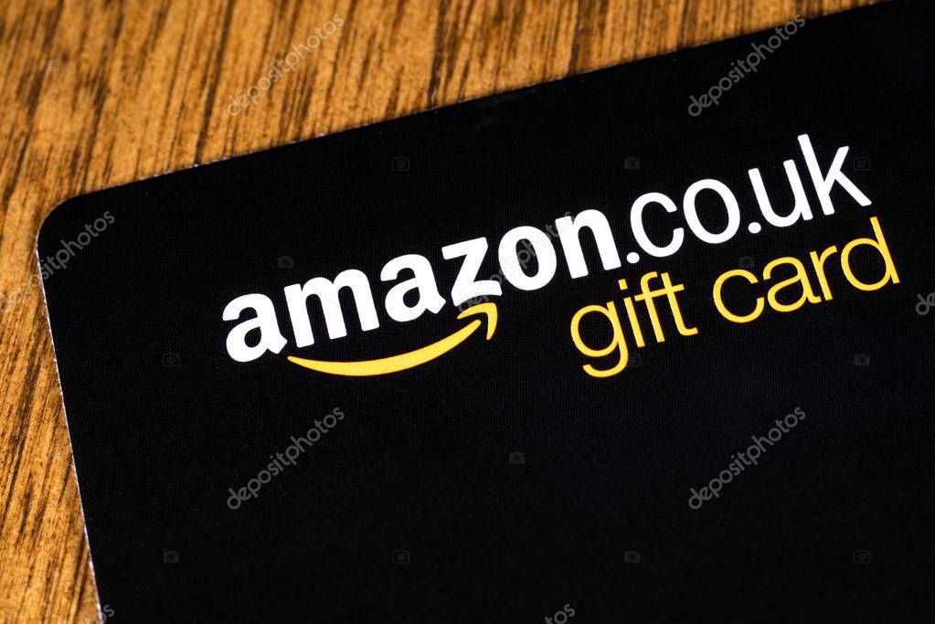 London, UK - June 11th 2019: An Amazon gift card pictured on a wooden surface.