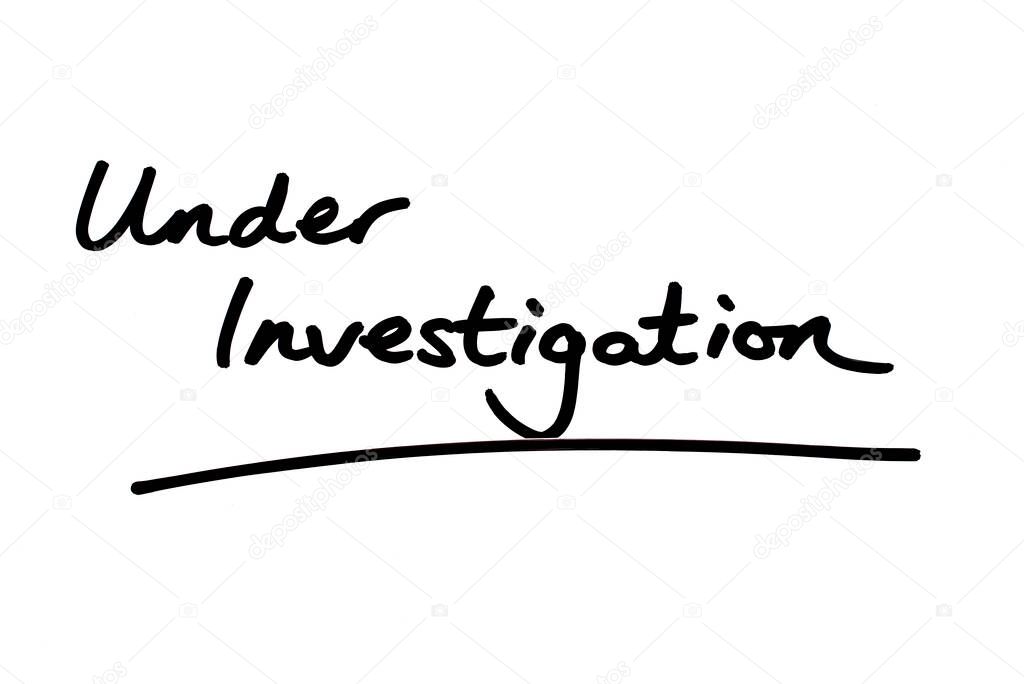 Under Investigation handwritten on a white background.