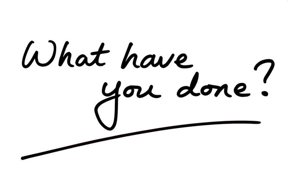 What have you done? handwritten on a white background.