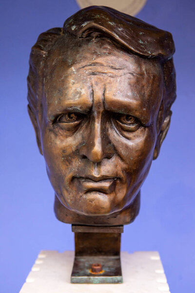 Portmeirion, Wales - September 1st 2020: A bust of actor Patrick McGoohan - star of The Prisoner, in the village of Portmeirion in North Wales, where the TV series was filmed.