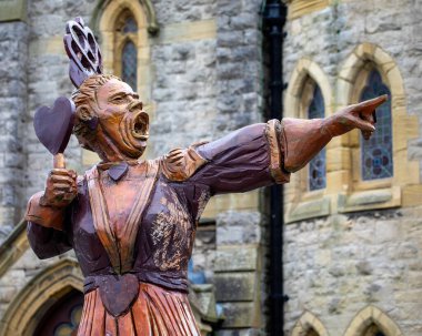 Llandudno, Wales - September 3rd 2020: A statue of the Queen of Hearts - a character from the Alice in Wonderland story, located in the seaside town of Llandudno in North Wales, UK. clipart