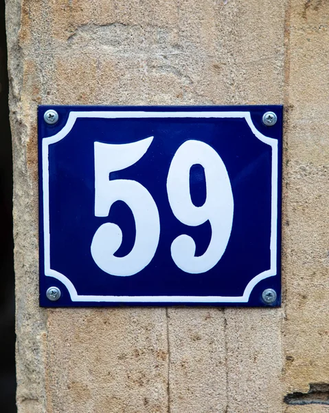 The number 59 on a blue plaque.