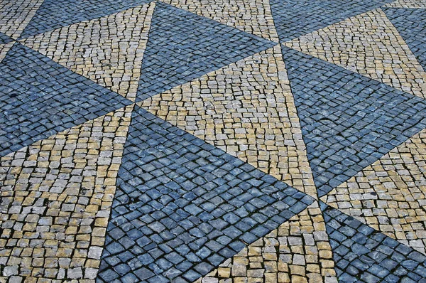 Sten mosaik på gatan i Lissabon — Stockfoto