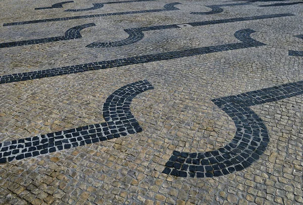 Calcada tradicional de mosaico de pedra portuguesa — Fotografia de Stock
