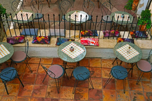 Round tables and chairs in a street cafe