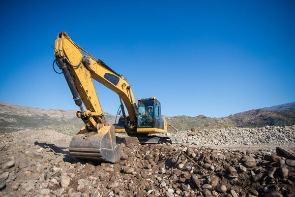 Close up wide angle view of an excavator on a construction site