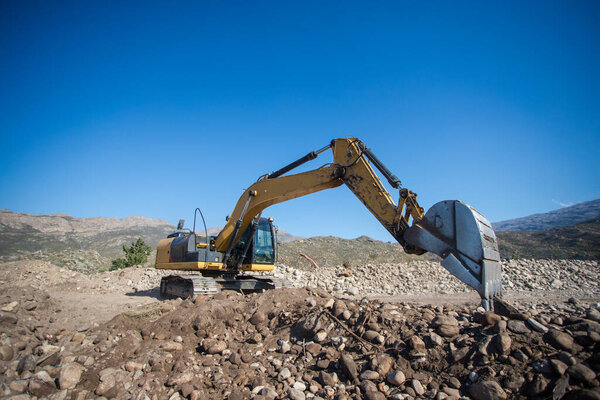 Close up wide angle view of an excavator on a construction site