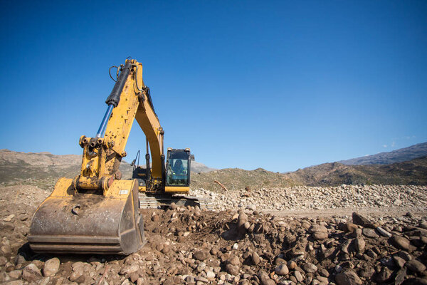 Close up wide angle view of an excavator on a construction site