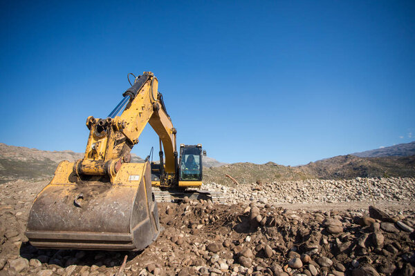 Close up wide angle view of an excavator on a construction site