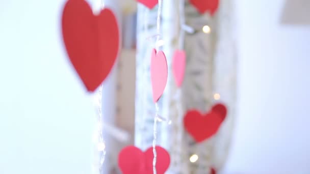 Paper heart, flashing lights, LED, window, defocus, garland — Stock Video