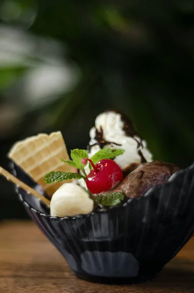 gourmet organic chocolate and strawberry ice cream sundae desser