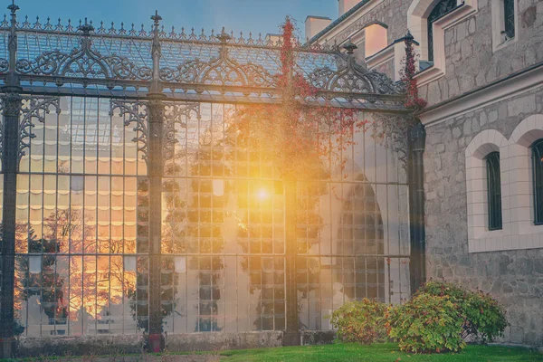 Gorgeous sun light reflection in glass garden of Hluboka nad Vltavou chateau. Sunset over Hluboka Castle, Czech Republic