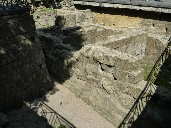 Subterranean ruins of the former western walls of the Ancient Greek city of Neapolis now in Piazza Bellini in Naples, Italy