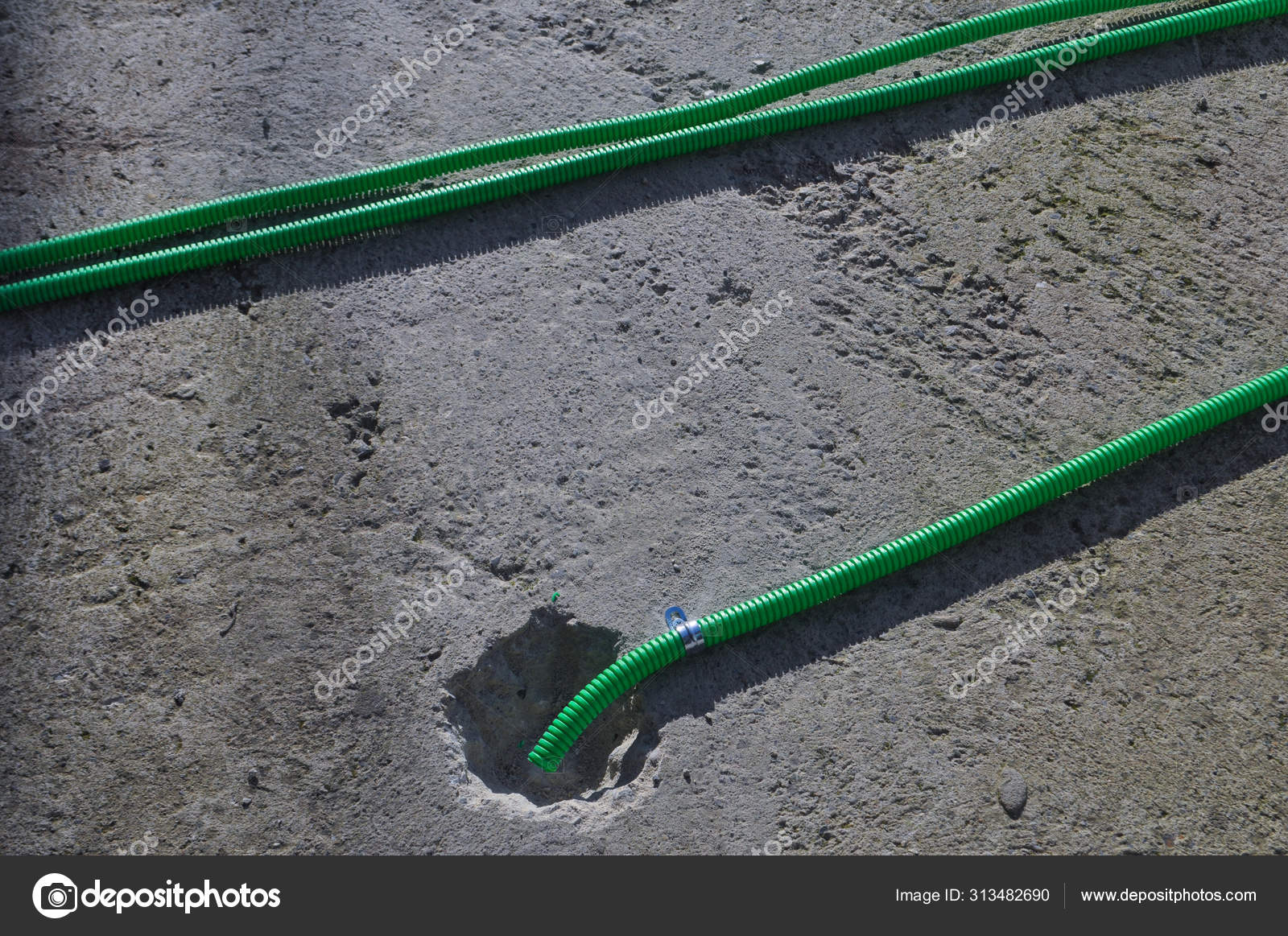 Green corrugated pipe Stock Photo by ©scrisman 313482690