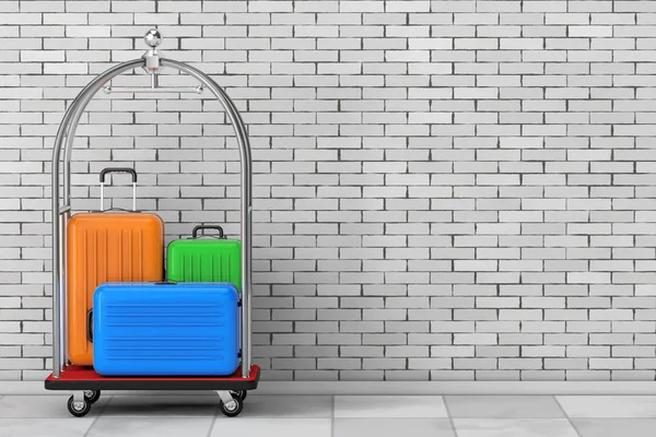 Large Multicolour Polycarbonate Suitcases in Silver Luxury Hotel Luggage Trolley Cart in front of brick wall. 3d Rendering