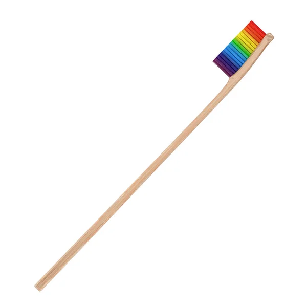 Renkli ahşap bambu diş fırçası ile gökkuşağı renkli kıl. — Stok fotoğraf