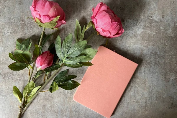 Background with flowers and wood and journal