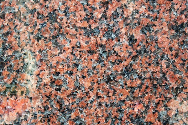 Red granite with large feldspar crystals polished surface