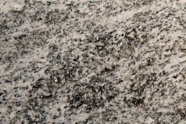 Metamorphic rock used as decorative stone with shiny minerals (mica)