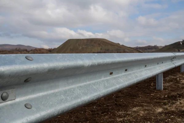 Steel guard rail barrier on the motorway without reflective sign