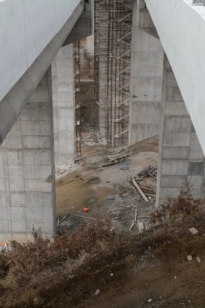 Bottom view on the bridge. Big concrete overpass. Building of the bridge. Bridge under construction