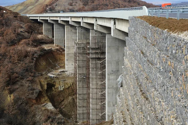 Bottom view on the bridge. Big concrete overpass. Building of the bridge. Bridge under construction