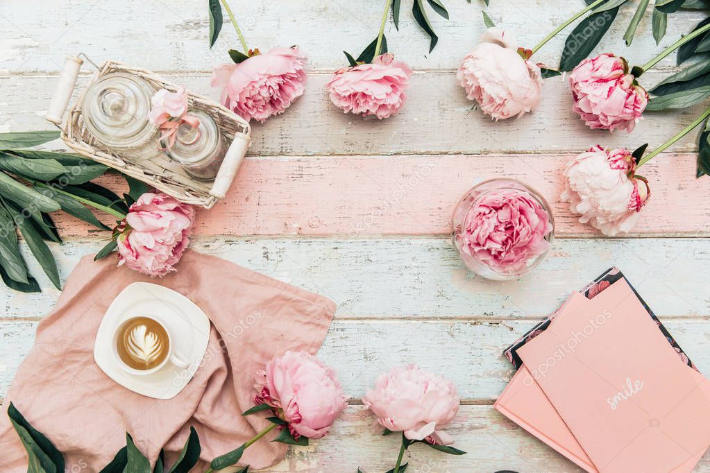 Flat lay empty card invitation. Festive background with sweet pink peony flowers.Top view with place for text