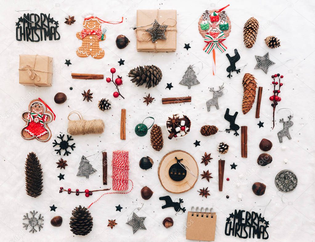 flat lay with different christmas holiday decorations on white tabletop