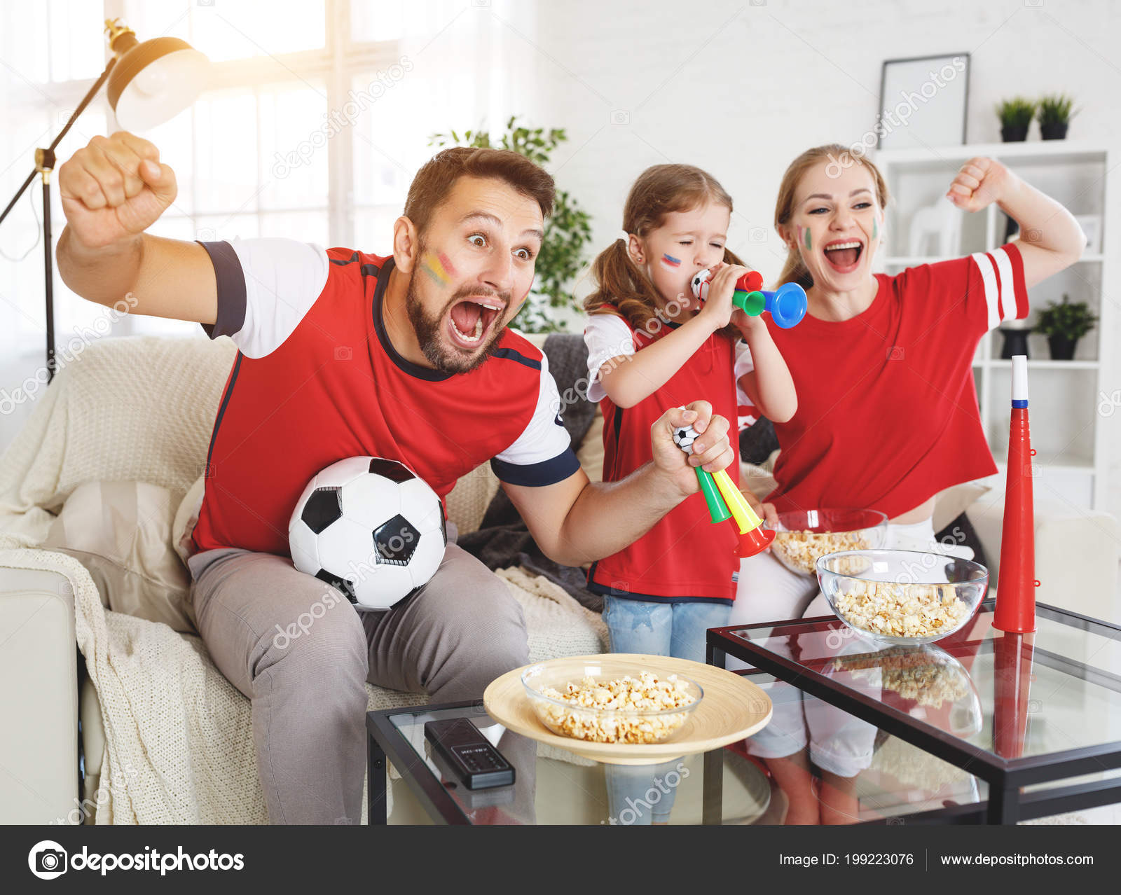 Family Fans Watching Football Match Hom Stock Photo by ©evgenyataman  199223076