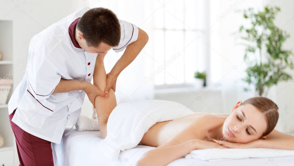 a beautiful girl enjoys massage and spa treatment