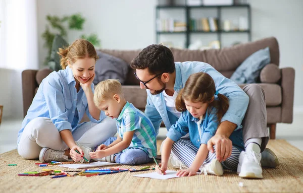 Happy family mother father and kids draw together at home — Stock Photo, Image