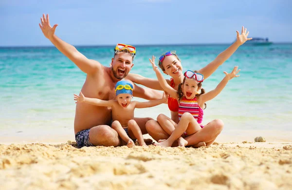 Happy family father, mother and children on  beach at sea — Stock Photo, Image