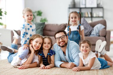 happy large family mother father and children   at home clipart