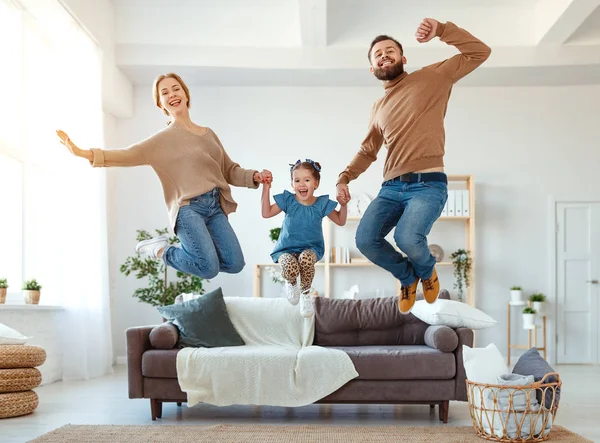 Happy family mother father and child daughter dancing at home — Stock Photo, Image